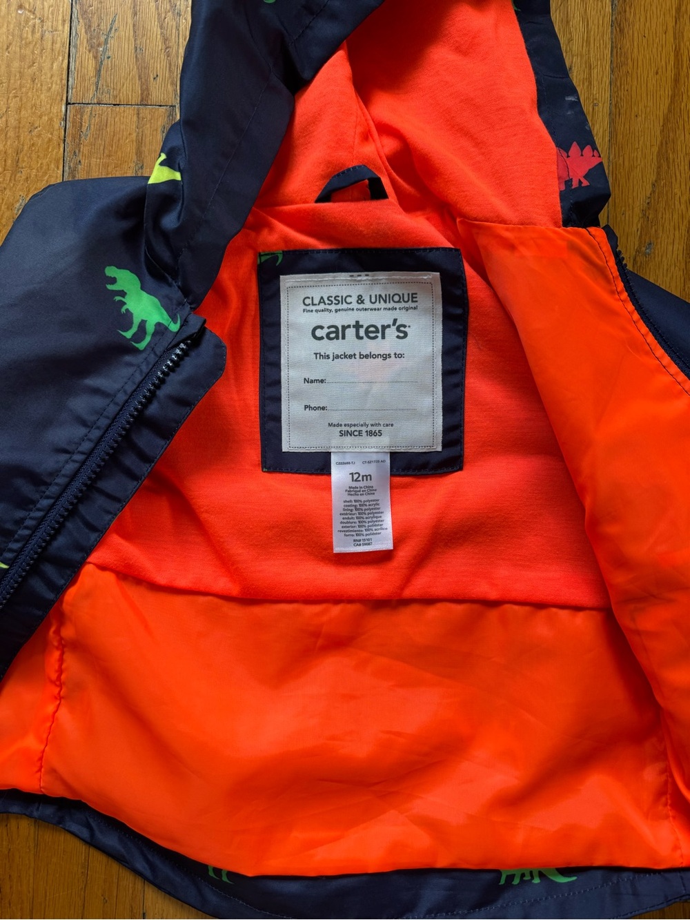 Carter's Navy rain Jacket with Bright Orange Lining and Green Dino Accents